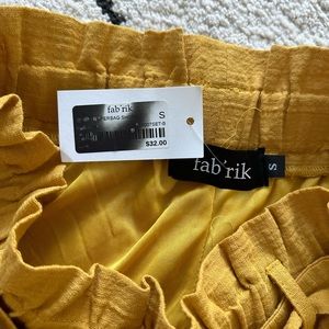 FAB RIK Yellow shorts with front tie (NWT)